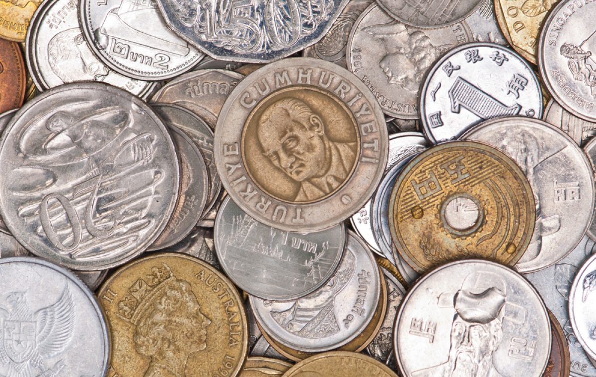 Coins currency from multiple countries, taken from top in isolated background view can be use for financial purposes